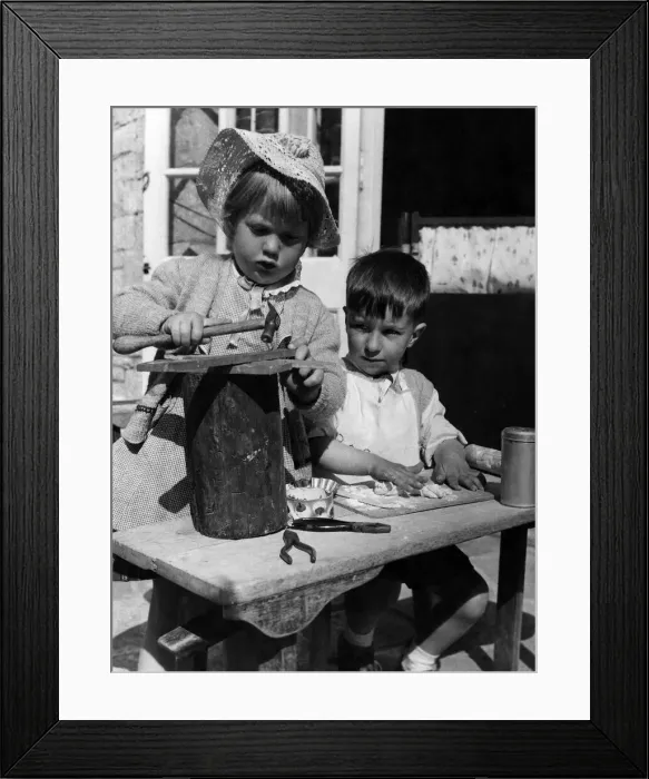 Framed Print : This corner of the nursery school has gone topsy-turvy. Boys are supposed to be fond of Framed Print : This corner of the nursery school has gone topsy-turvy. Boys are supposed to be fond of