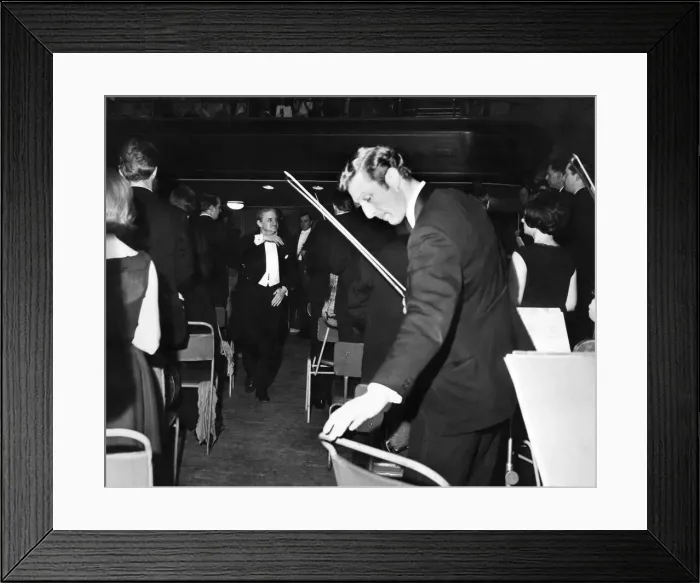Framed Print : The Halle Orchestra stand to Sir John Barbirolli as he leaves the stage of the Free Trade Framed Print : The Halle Orchestra stand to Sir John Barbirolli as he leaves the stage of the Free Trade