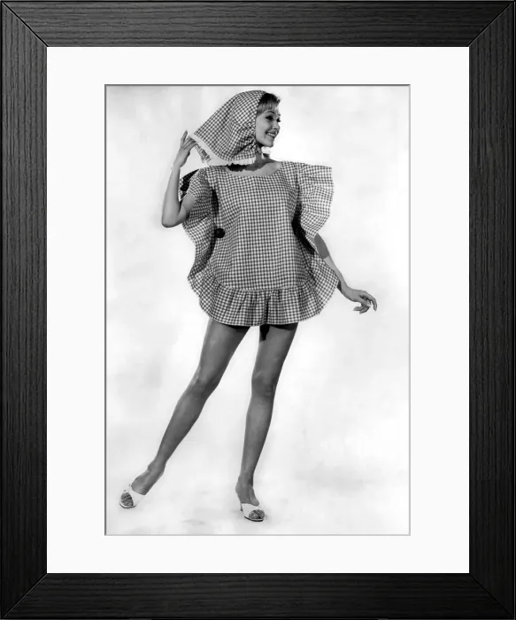 Framed Print : Woman wearing an unusual pillow case shaped dress with matching headscarf