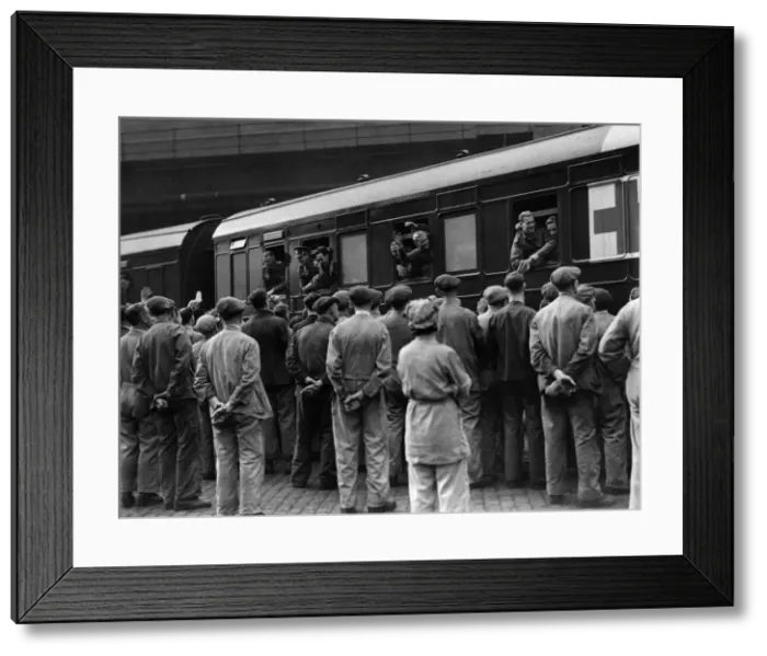 Framed Print : A group of workmen cheering some of the repatriated and wounded prisoners who were able Framed Print : A group of workmen cheering some of the repatriated and wounded prisoners who were able