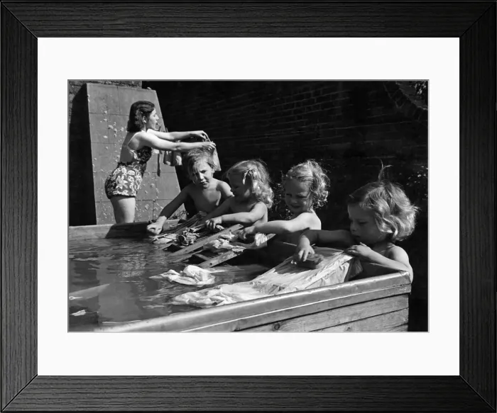 Framed Print : Nurse runs babies back-garden swimming pool Framed Print : Nurse runs babies back-garden swimming pool