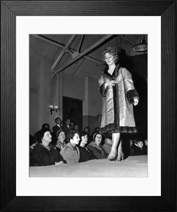 Framed Print : Janet Thompson in a brocade-lined wild mink, worn inside out displays the coat