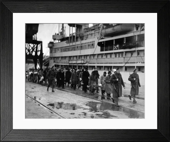 Framed Print : Refugees from Dutch colonies marching along the quayside under Dutch soldier escort Framed Print : Refugees from Dutch colonies marching along the quayside under Dutch soldier escort