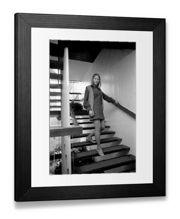 Framed Print : Woman wearing a mini skirt standing on the steps Linda Sewell December 1969 Framed Print : Woman wearing a mini skirt standing on the steps Linda Sewell December 1969
