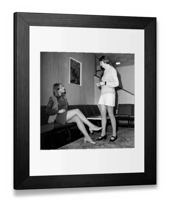 Framed Print : Model Linda Sewell aged 18 wearing a mini skirt and Christine Davies (17) chatting