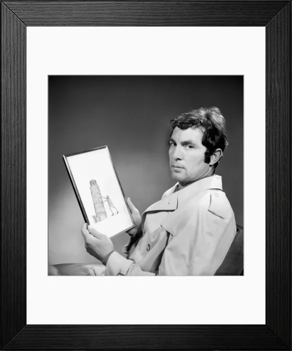 Framed Print : People Men Humour. A man wearing an overcoat holding a framed picture of the leaning Framed Print : People Men Humour. A man wearing an overcoat holding a framed picture of the leaning