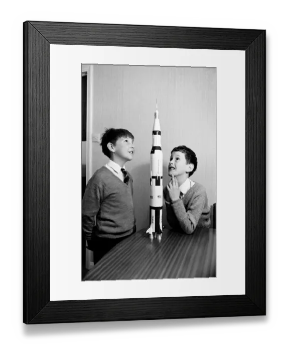 Framed Print : Apollo 12 moon rocket model on display. L to R, Paul Ward