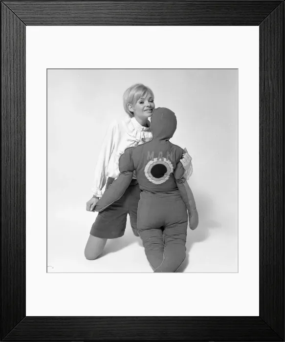 Framed Print : Woman Model with pillows in the shape of man and child. January 1968. Y5 Framed Print : Woman Model with pillows in the shape of man and child. January 1968. Y5