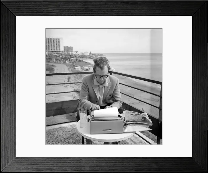 Framed Print : Johnny Speight TV Script Writer - on Spains Costa del Sol sitting at a table Framed Print : Johnny Speight TV Script Writer - on Spains Costa del Sol sitting at a table