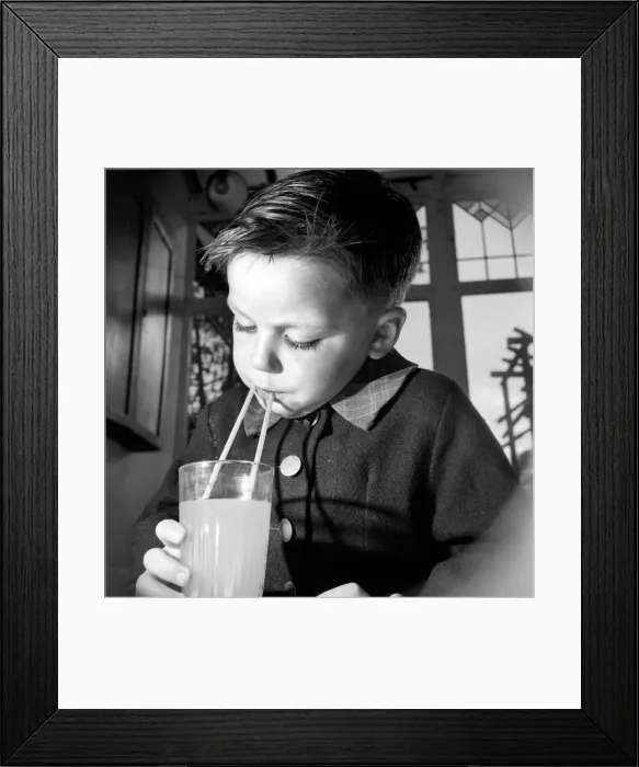 Framed Print : Children: Drink. Study picture taken of a four year old boy making the most of his