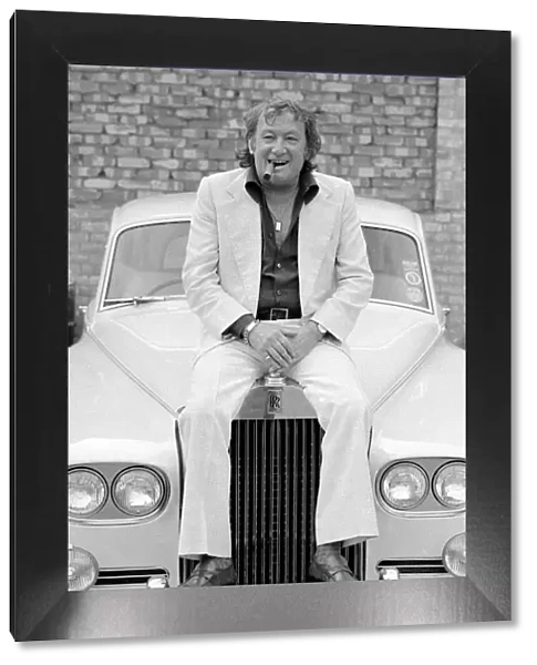 Johnny Speight TV Script Writer - sitting on the bonnet of his Rolls Royce A©
