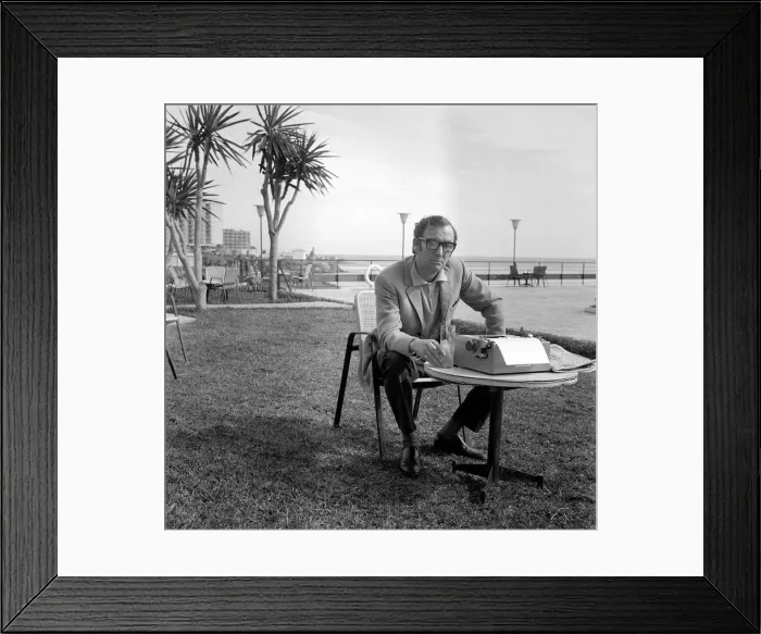 Framed Print : Johnny Speight TV Script Writer - on Spains Costa del Sol sitting at a table Framed Print : Johnny Speight TV Script Writer - on Spains Costa del Sol sitting at a table