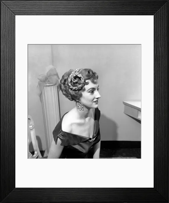 Framed Print : A new elaborate hair style created by Jose Et Francke of 171 New Bond-street for model