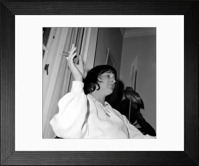 Framed Print : American pop singer P J Proby smokes a cigar at a press conference after he had been Framed Print : American pop singer P J Proby smokes a cigar at a press conference after he had been