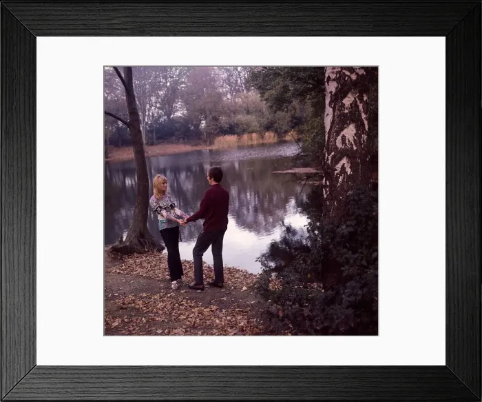 Framed Print : Young couple enjoying themselves by the lake Framed Print : Young couple enjoying themselves by the lake