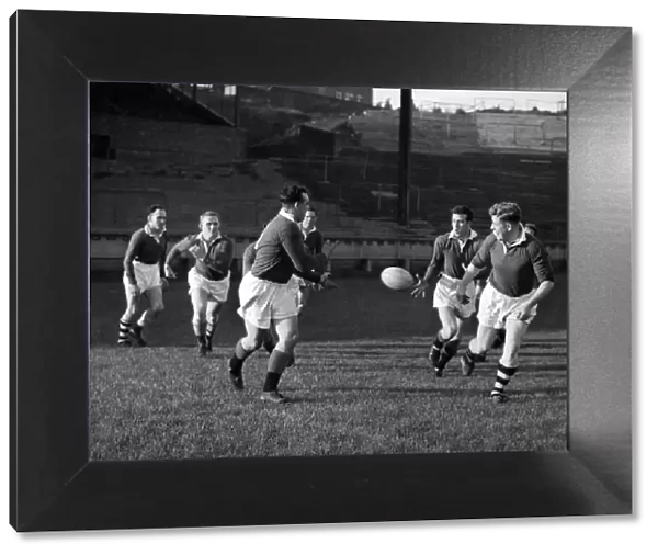 Wigan players practice passing tactics during training today. October 1957 P012584