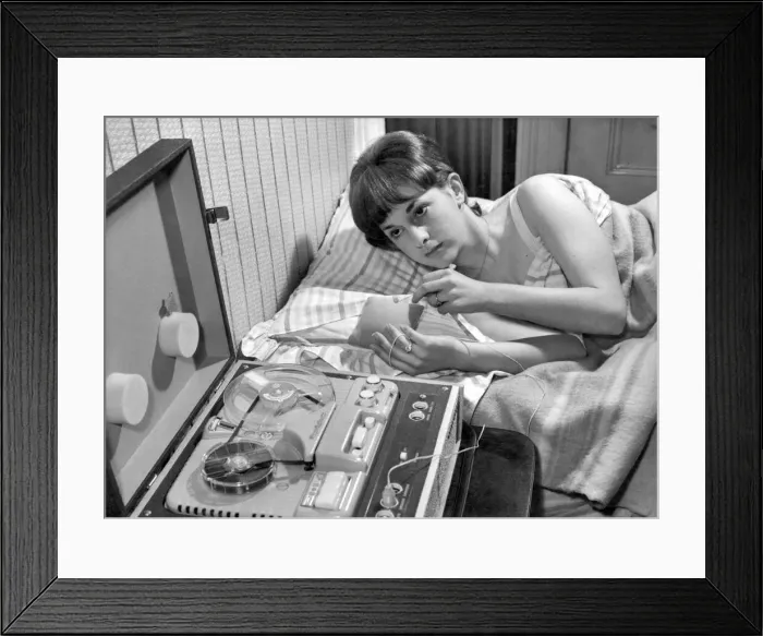 Framed Print : Learn while you sleep machine. While this young lady sleeps peacefully a tiny loudspeaker Framed Print : Learn while you sleep machine. While this young lady sleeps peacefully a tiny loudspeaker