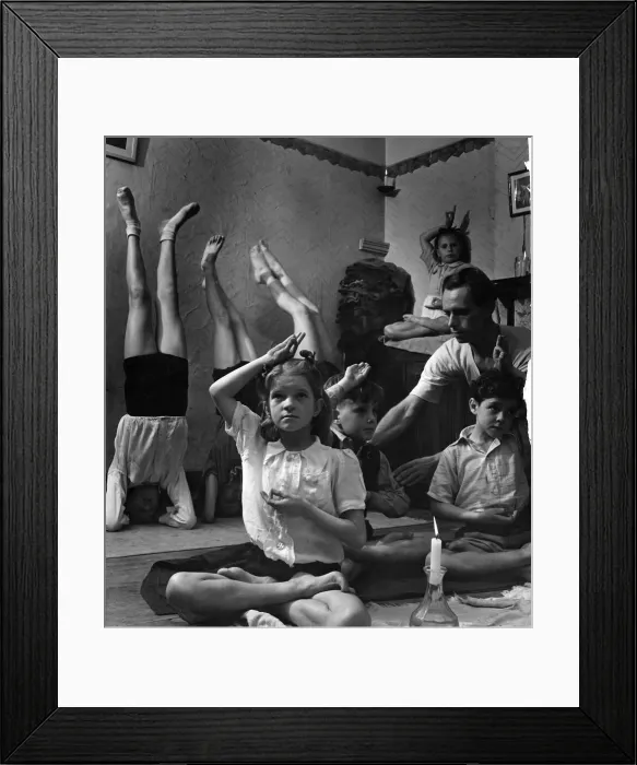 Framed Print : In the candle e lit basement room, 10 years old Patricia Sullivan is concentrating in Framed Print : In the candle e lit basement room, 10 years old Patricia Sullivan is concentrating in