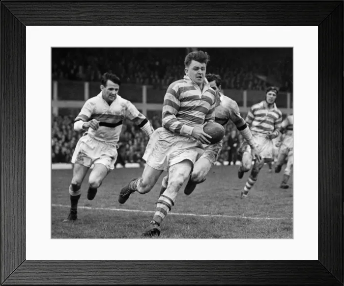 Framed Print : Silcock of Wigan bursts through beating several Bradford players to score a fine try in