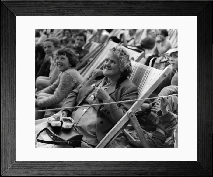 Framed Print : Holidays: This elderly holidaymaker enjoys the Mirror Beach Fashion Show at Yarmouth Framed Print : Holidays: This elderly holidaymaker enjoys the Mirror Beach Fashion Show at Yarmouth