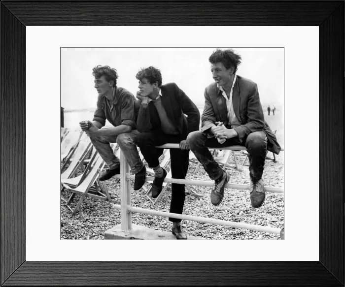 Framed Print : Holidays: Daily mirror beach wear show. Some lads watching during their break time Framed Print : Holidays: Daily mirror beach wear show. Some lads watching during their break time