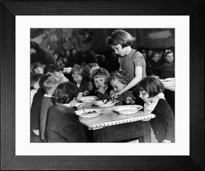 Framed Print : Eileen Meakin, aged 13, with some of her little charges at a Hoxton Children