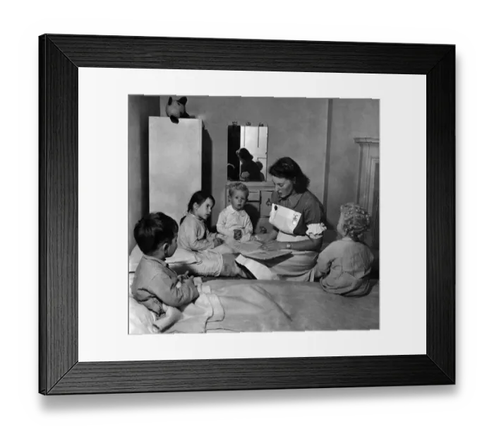 Framed Print : Matron Doris Naughten reads some fairy tales to (left to right) Nigel Paneth, Susan Conen Framed Print : Matron Doris Naughten reads some fairy tales to (left to right) Nigel Paneth, Susan Conen