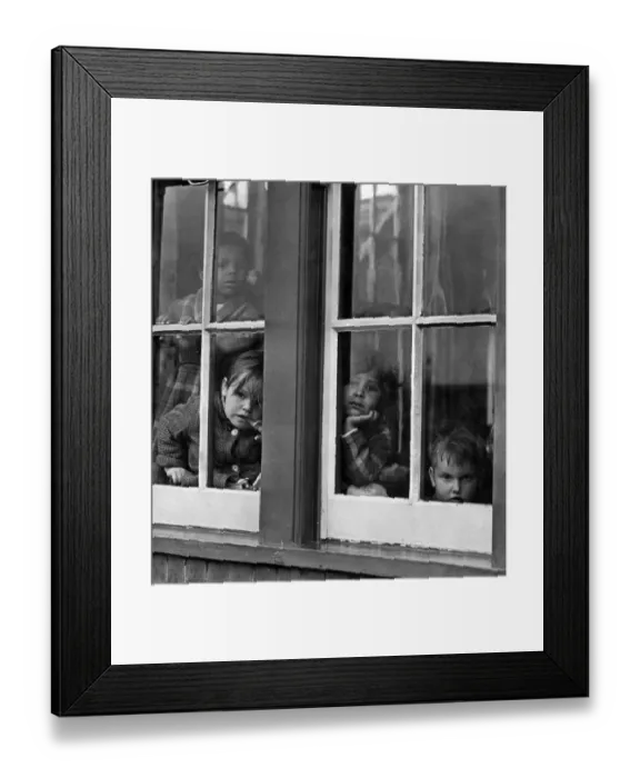 Framed Print : Children: Nurseries. Some of the children looking out of a window at the childrens Framed Print : Children: Nurseries. Some of the children looking out of a window at the childrens