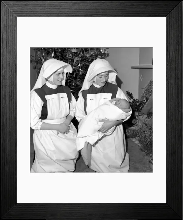 Framed Print : Nuns. Nursing sisters seen here with baby Noel born Christmas Day. December 1953 D7672 Framed Print : Nuns. Nursing sisters seen here with baby Noel born Christmas Day. December 1953 D7672