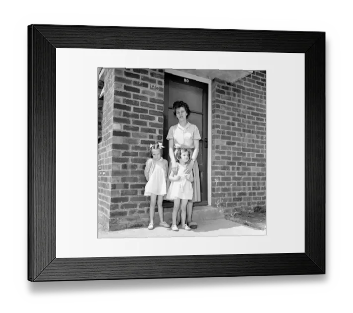 Framed Print : Mrs. Kirby and her daughters, Carol, 5, and Sandra, 4, outside their council house today Framed Print : Mrs. Kirby and her daughters, Carol, 5, and Sandra, 4, outside their council house today