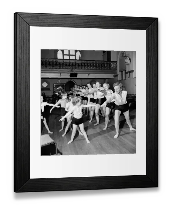 Framed Print : Health and Beauty: Wimbledon mothers and their children keep fit at the local church hall Framed Print : Health and Beauty: Wimbledon mothers and their children keep fit at the local church hall