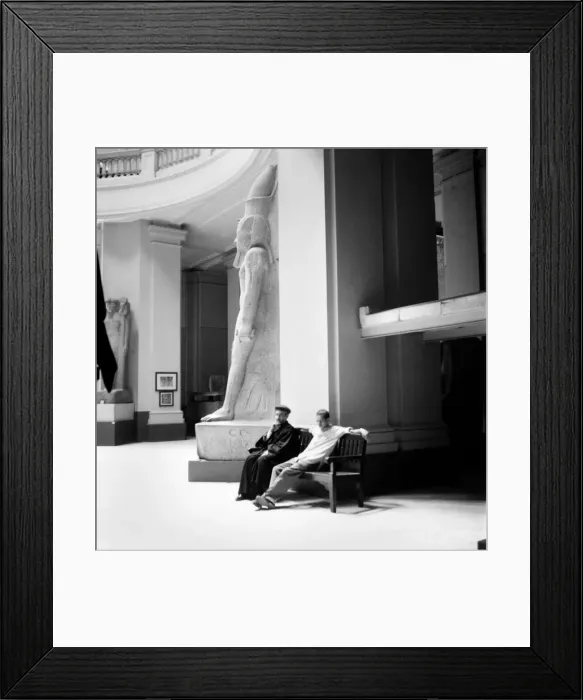 Framed Print : Egypt: Religion: A Coptic priest and his companion rest beside a statue of Ramese in Framed Print : Egypt: Religion: A Coptic priest and his companion rest beside a statue of Ramese in