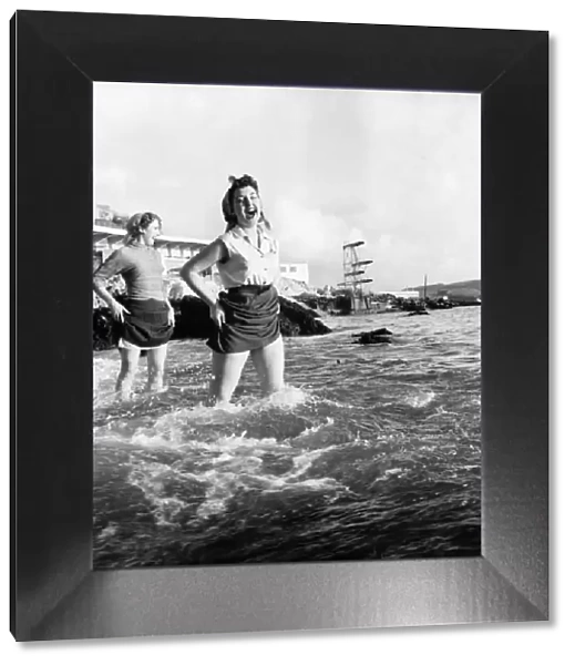 Holidays: Girls Paddling in the water at Plymouth. November 1953 D6998