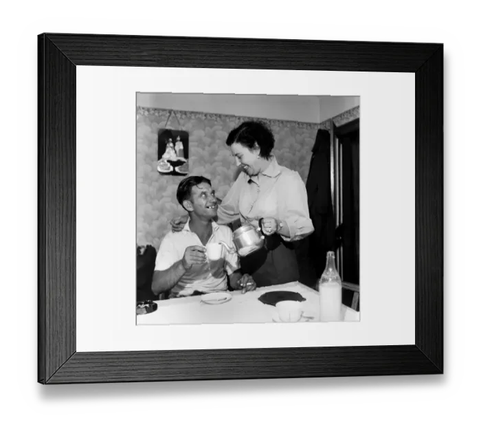Framed Print : Conflict: Korean War. Prisoner of War Tommy Nugent seen here arriving home after being