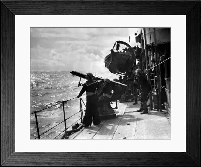 Framed Print : Guarding our Convoys. Men aboard a destroyer on escort duty fire warning shots to