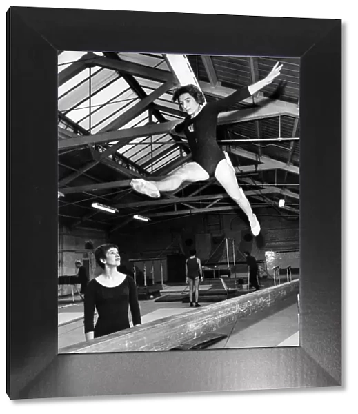 Margaret Bell does a splits jump, Mary Prestidge watches. September 1968 P011462