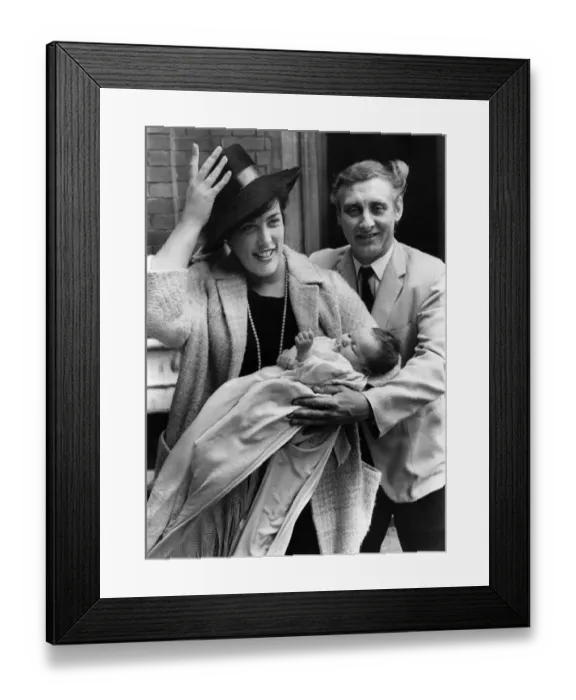 Framed Print : Spike Milligan and wife having hat trouble with baby Jane Fionulla after the christening