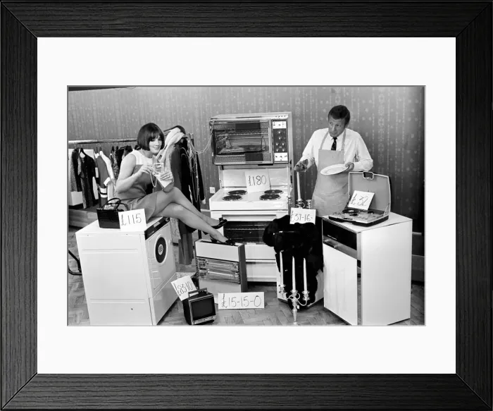 Framed Print : A man a woman living in a sububan area of Manchester at home