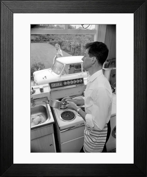 Framed Print : A man a woman living in a sububan area of Manchester at home
