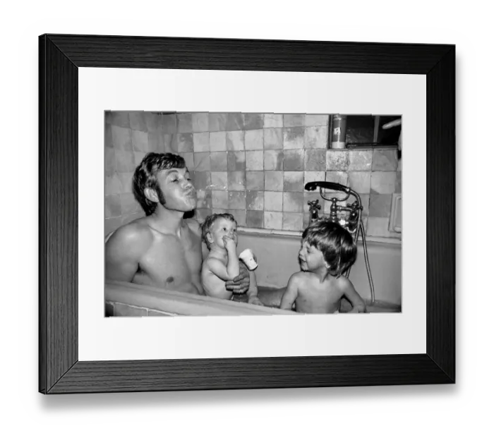 Framed Print : Families: Mother, father and children. Father in the bath with baby boy and son