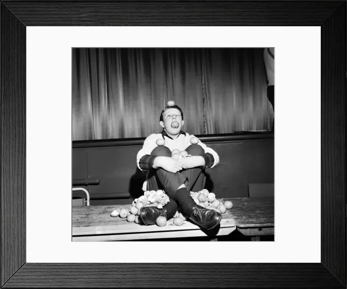 Framed Print : Guenter Kuhn, the 14 years old world champion orange eater