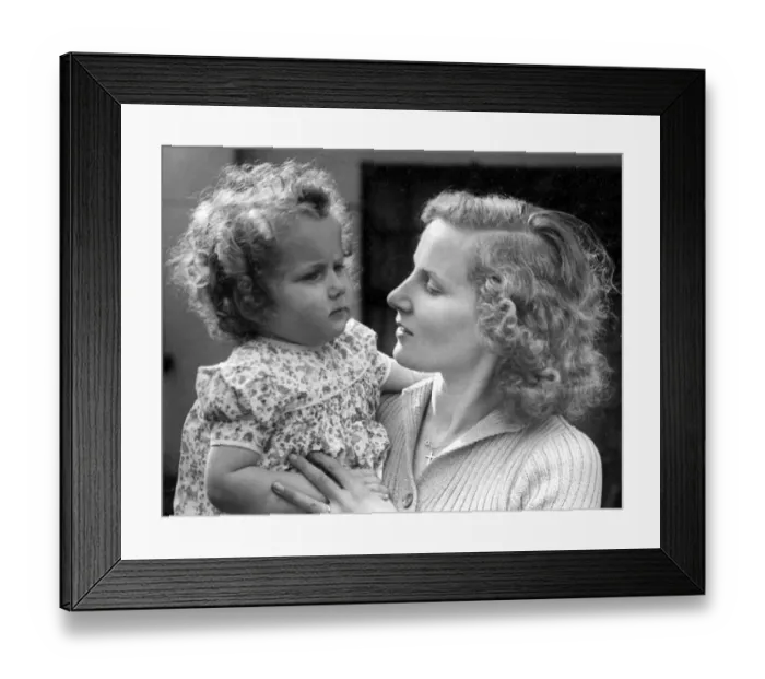 Framed Print : Mother holding her baby girl in her arms Circa 1945 P044456 Framed Print : Mother holding her baby girl in her arms Circa 1945 P044456