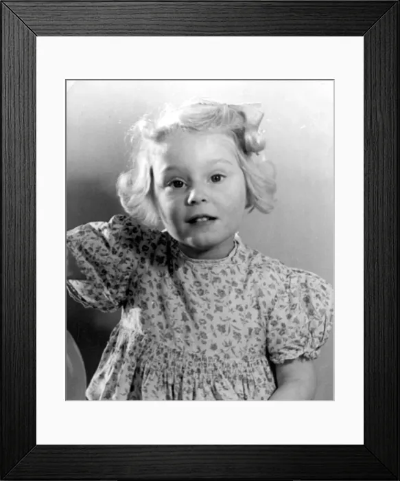Framed Print : Young girl wearing a flowery dress Circa 1945 P044423 Framed Print : Young girl wearing a flowery dress Circa 1945 P044423