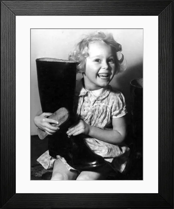 Framed Print : Young girl polishing a pair of wellington boots Circa 1945 P044462 Framed Print : Young girl polishing a pair of wellington boots Circa 1945 P044462