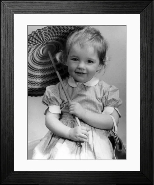 Framed Print : Young girl holding up a parasol Circa 1945 P044459 Framed Print : Young girl holding up a parasol Circa 1945 P044459