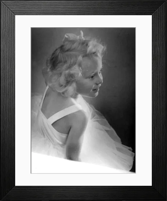 Framed Print : Young girl wearing a white dress Circa 1945 P044466