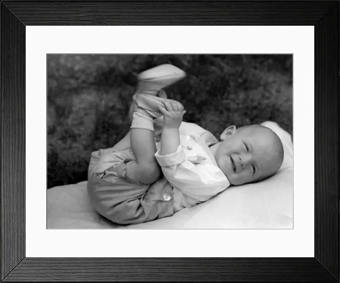 Framed Print : Baby lying outside in the garden. c. 1945 P044490 Framed Print : Baby lying outside in the garden. c. 1945 P044490