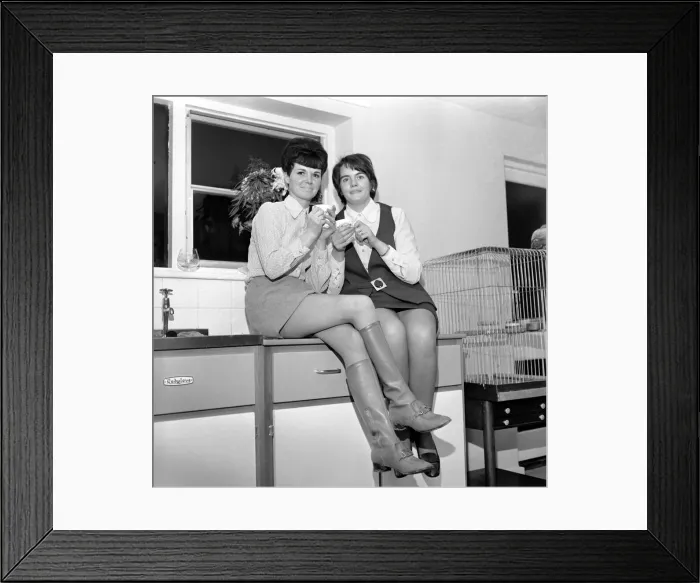 Framed Print : Two women decorating the Christmas Tree and enjoying a cup of tea Framed Print : Two women decorating the Christmas Tree and enjoying a cup of tea