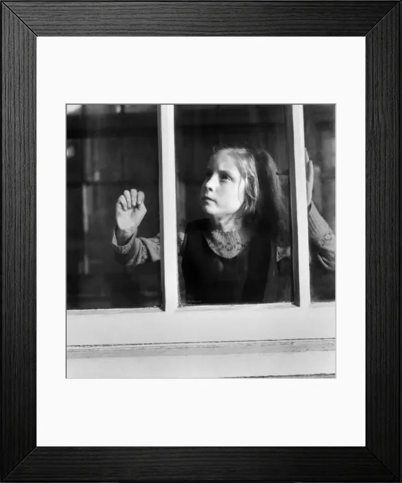 Framed Print : Children. Orphan girl looking out of window. December 1953 D7311-001 Framed Print : Children. Orphan girl looking out of window. December 1953 D7311-001