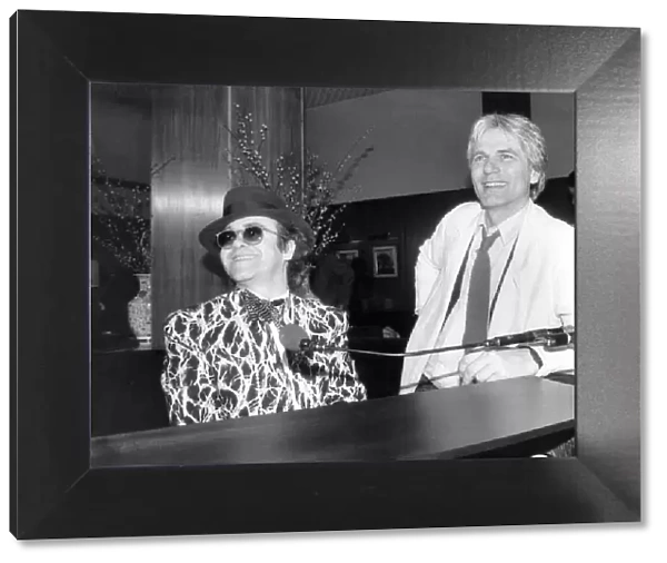 Elton John and Adam Faith at the Savoy. 1985. P009653
